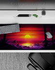 36x16 inches desk pad with Sunset City Stroll, showcasing a vivid sunset and dark palm trees against a dystopian city backdrop.