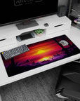 Artistic 36x16 inches desk pad with Sunset City Stroll, blending the warmth of a sunset with the coolness of a futuristic city and dark palm trees.