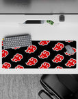Bold Akatsuki theme on 32x12 mouse pad featuring iconic clouds for Naruto series enthusiasts