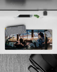 Cozy sunset anime girl mouse pad 28x12 inches in warm orange glow, smoky shadows, soft lens specks.