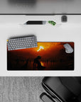 28x12 inches mouse pad with a solitary figure kneeling beneath a fiery sunset, surrounded by dark shadows, perfect for fans of melancholic and moody aesthetics.
