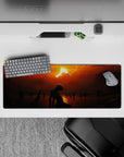 32x12 inches mouse pad with a dark and moody landscape, showcasing a lone figure under a fiery sunset, perfect for creating a quiet, mysterious workspace.