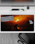 32x16 inches mouse pad with a lone figure under a fiery sunset, surrounded by dark silhouettes, ideal for creating a serene and mysterious desk setup.