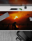 40x20 inches desk pad showcasing a lone figure in a dark, moody landscape under a fiery sunset, perfect for fans seeking a melancholic and mysterious aesthetic.