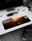 Artistic 32x12 inches mouse pad featuring a lone figure beneath a fiery sunset, surrounded by dark silhouettes, ideal for transforming your desk with a sense of solitude.