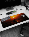 Artistic 36x16 inches desk pad featuring a lone figure beneath a fiery sunset, evoking loneliness and mystery, perfect for adding dramatic atmosphere to your desk.