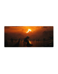 Mouse pad featuring a lone figure under a fiery sunset with dark silhouettes, 28x12 inches, perfect for adding loneliness and quiet mystery to your workspace.