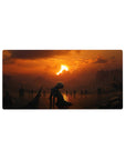 Mouse pad featuring a lone figure kneeling under a fiery sunset with dark silhouettes, 32x16 inches, perfect for adding solitude and quiet beauty to your workspace.