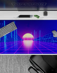 Otherworldly 40x20 desk pad showcases wireframe mountains and sunset hues for immersive retrowave style