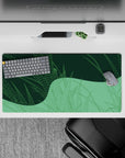 Dynamic 32x16 desk mat combines delicate greens and sharp geometric lines for impactful yet soothing visuals
