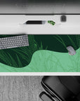 Striking 36x16 desk pad highlights soft green tones and intricate geometric details in stunning simplicity