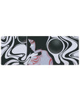 Surreal 32x12 mouse pad featuring a feminine silhouette, flowing black and white curves, and soft red and grayscale elements for a dreamlike look