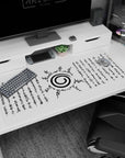Anime mouse pad featuring Uzumaki clan symbol from Naruto in black ink on white, 40x20 inches, with ancient text design.