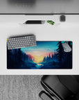 28x12 inches mouse pad featuring a forest sunrise with towering pines and a river, creating a serene, outdoorsy vibe.