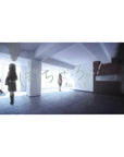 Anime school hallway scene desk pad with Japanese lettering, 40x20 inches.