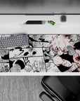 36x16 inches anime desk pad in heavy blacks and dusty whites with sharp red splatter, intense mood.