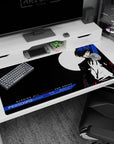 Anime desk pad 40x20 inches featuring Persona 3 protagonist in black suit, blue hair, and moon backdrop, bold color palette.