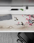 36x16 inches desk pad with plum blossom and bird design, capturing a tranquil scene of pink blooms, a serene bridge, and gentle mist.