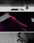 40x20 inches desk pad with neon light design, showcasing pink and red streaks on a starry backdrop for a dynamic, futuristic energy at your desk.