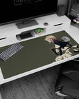Blonde anime heroine crouching in profile on desk pad 40x20 inches, eyes on horizon, wind-swept cape.
