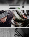Dynamic 40x20 desk pad showcasing swirling speed and precision of iconic rivals for bold anime setups