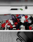 Striking 36x16 desk pad highlights Touka and Tsukiyama surrounded by vivid red roses, intricate details, and gothic contrasts in stunning visual artistry