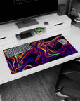Modern 32x16 inches mouse pad featuring swirling neon hues, with purples, reds, and yellows for a bold, futuristic, and captivating design.