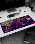 Artistic 36x16 inches mouse pad featuring swirling neon hues, with electric purples, fiery reds, and luminous yellows for a mesmerizing aesthetic.