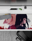 Moody romance anime desk pad 36x16 inches in soft cream light with drifting crimson petals, violet gaze.