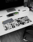 32x12 inches anime mouse pad showing bald fighter at left and caped brawler charging amid monsters.