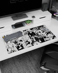 32x16 inches anime mouse pad showing calm bald fighter left and caped brawler charging amid monsters.