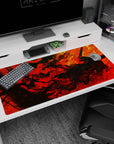 Large 40x20 inches desk pad with Guts in the heart of the flames, with fiery red and orange swirls, ideal for adding powerful energy and intensity to your desk setup.