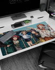 Winking anime girl waving on a seaside deck, friends crowding in, desk pad 40x20 inches.