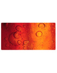 Amber Flow Desk Mat 32x16 featuring liquid bubbles for gaming or workspace energy with artistic warmth