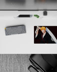 Anime mouse pad 14x10 inches features Ichigo Kurosaki silhouette from Bleach with black robes and orange hair on burgundy.