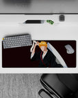 Ichigo Kurosaki minimalist silhouette on 32x12 inch mouse pad, black robes, orange hair, Bleach anime, burgundy backdrop.