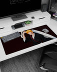 Anime desk pad 36x16 inches featuring Ichigo Kurosaki silhouette from Bleach; black robes, orange hair, and Zangetsu.
