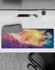 Dreamy pastel galaxy mouse pad 32x12 inches in peach gold, rosy pink, violet, and starry blue.