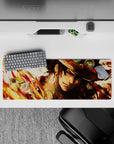Intense 32x12 mouse pad features Ace's bold aura with red orange and gold hues for One Piece fans