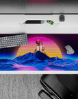 36x16 inches desk pad with a futuristic neon sunset and vibrant wireframe landscape in pinks and blues, creating a retro aesthetic.