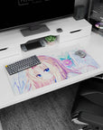 Golden-blonde anime angel girl with blue eyes among blush blooms on a 32x16 inches mouse pad.
