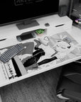 Tohru maid pose desk pad 40x20 inches, curled horns, ribbons and stockings sprawled across the mat.