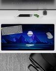 Cosmic 32x16 mouse pad with a glowing full moon, starry sky, and towering peaks, perfect for adding quiet inspiration to your desk