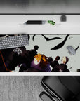 Moody orange-and-black anime desk pad 36x16 inches with pale sky, black feathers, and pre-match tension.