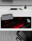 Intense 32x12 desk mat features sharp angles and bold red-black contrast with intricate details for fans of precision