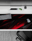 Striking 36x16 desk pad highlights sharp black and red tones with intricate angular details in stunning artistry