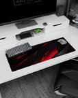 Small but impactful 32x12 desk mat showcases gaming intensity with striking angular artistry