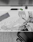 Makima and Chainsaw Man clash on a 40x20 inch anime desk pad, capturing tension and power in grayscale ink and blood.