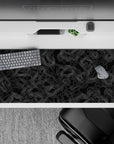36x16 inches desk pad with topographic contours, showcasing fine white lines against a sleek black backdrop, creating a minimalist and elegant design.