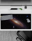 Calming deep black mouse pad 32x16 inches with creamy glow, wispy blues, violet haze, amber sparks.